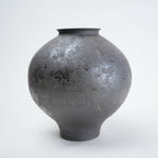 Two gray ceramic vases for styling flowers in living room, coffee tables or consoles
