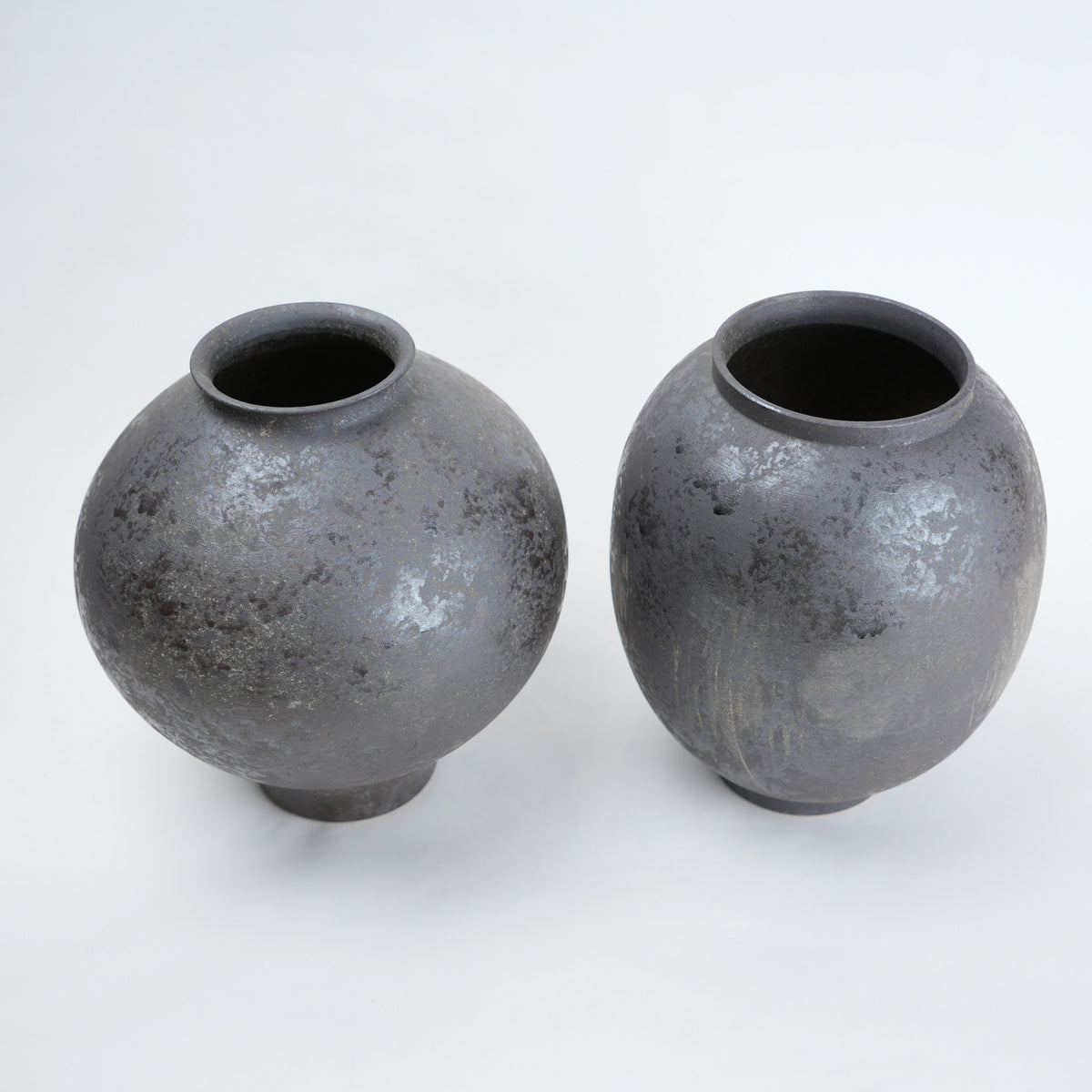 Two gray ceramic vases for styling flowers in living room, coffee tables or consoles