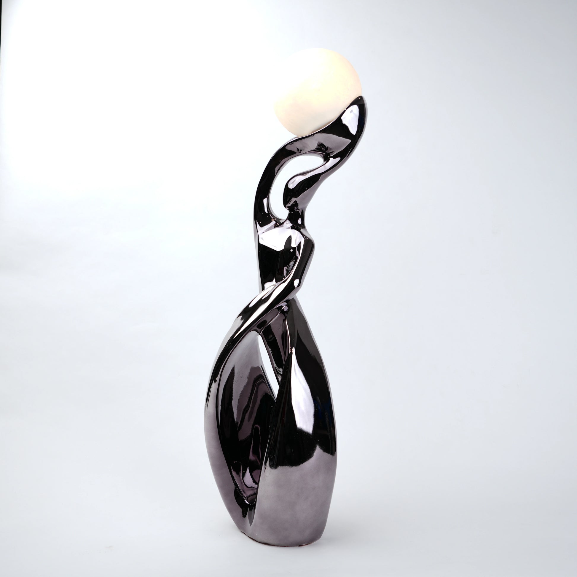 modern sculptural table lamp with glowing orb ambient lighting