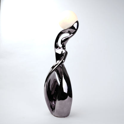 modern sculptural table lamp with glowing orb ambient lighting
