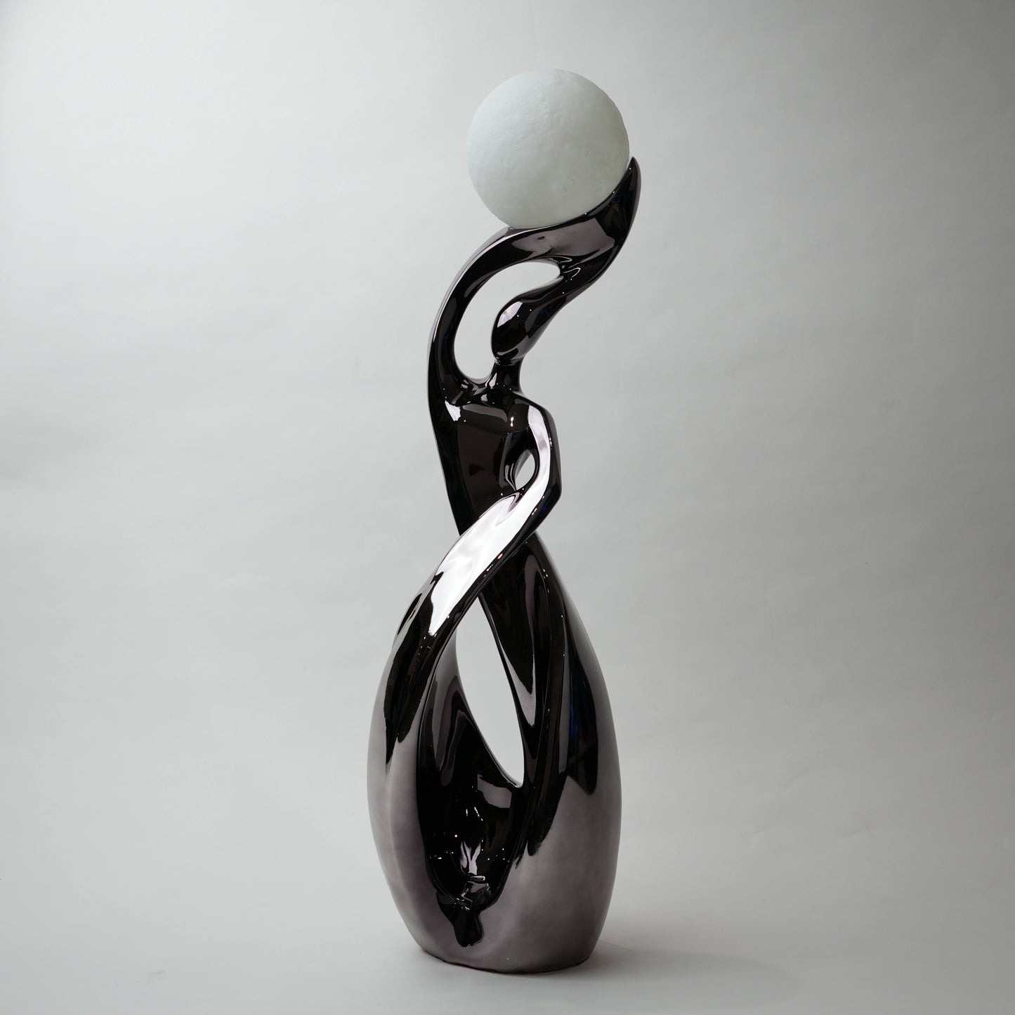 modern sculptural table lamp with glowing orb ambient lighting