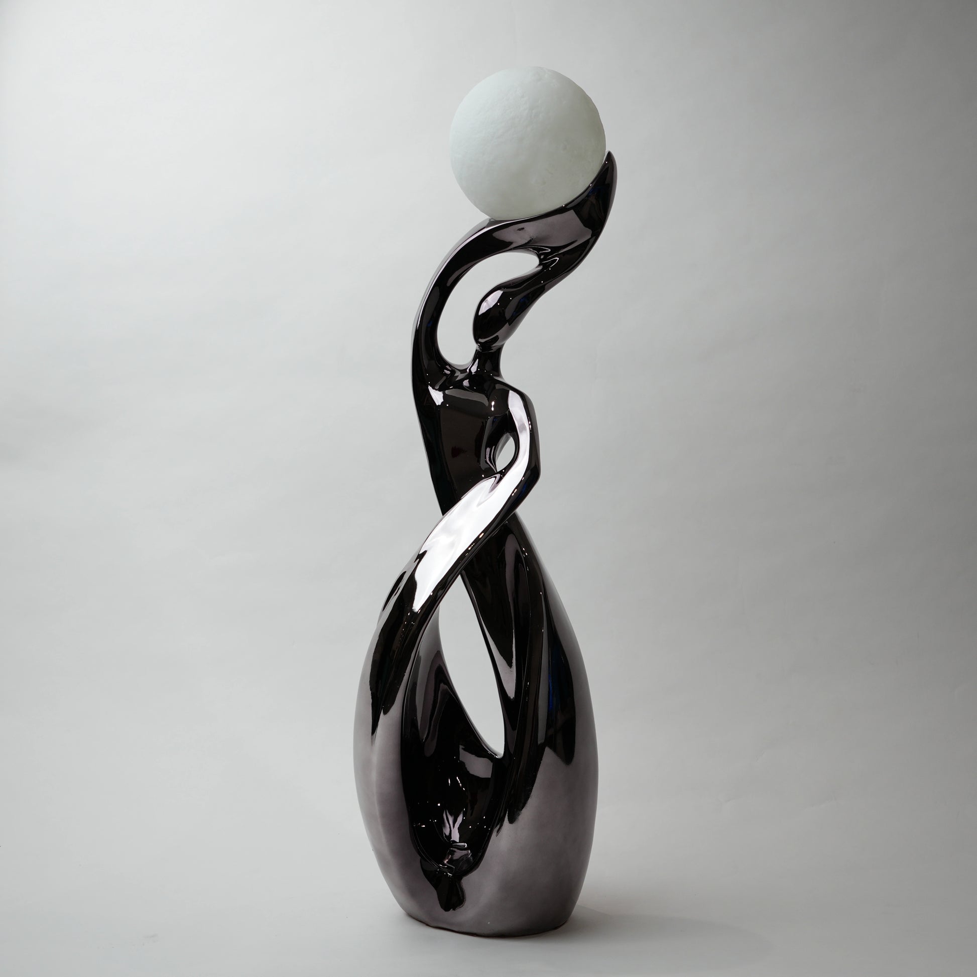 modern sculptural table lamp with glowing orb ambient lighting