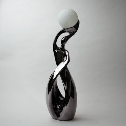 modern sculptural table lamp with glowing orb ambient lighting