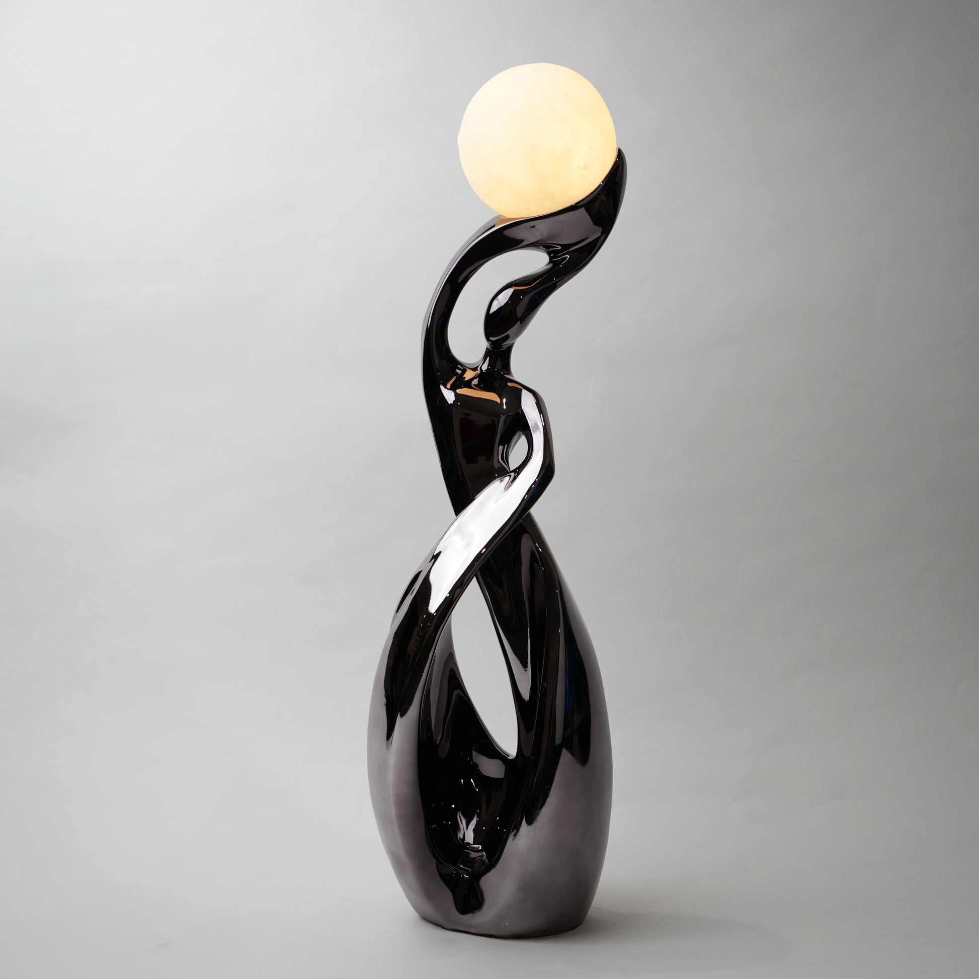 modern sculptural table lamp with glowing orb ambient lighting