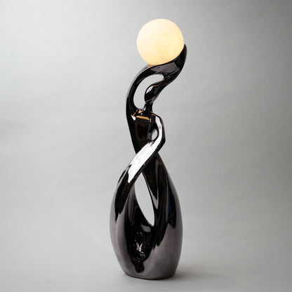 modern sculptural table lamp with glowing orb ambient lighting