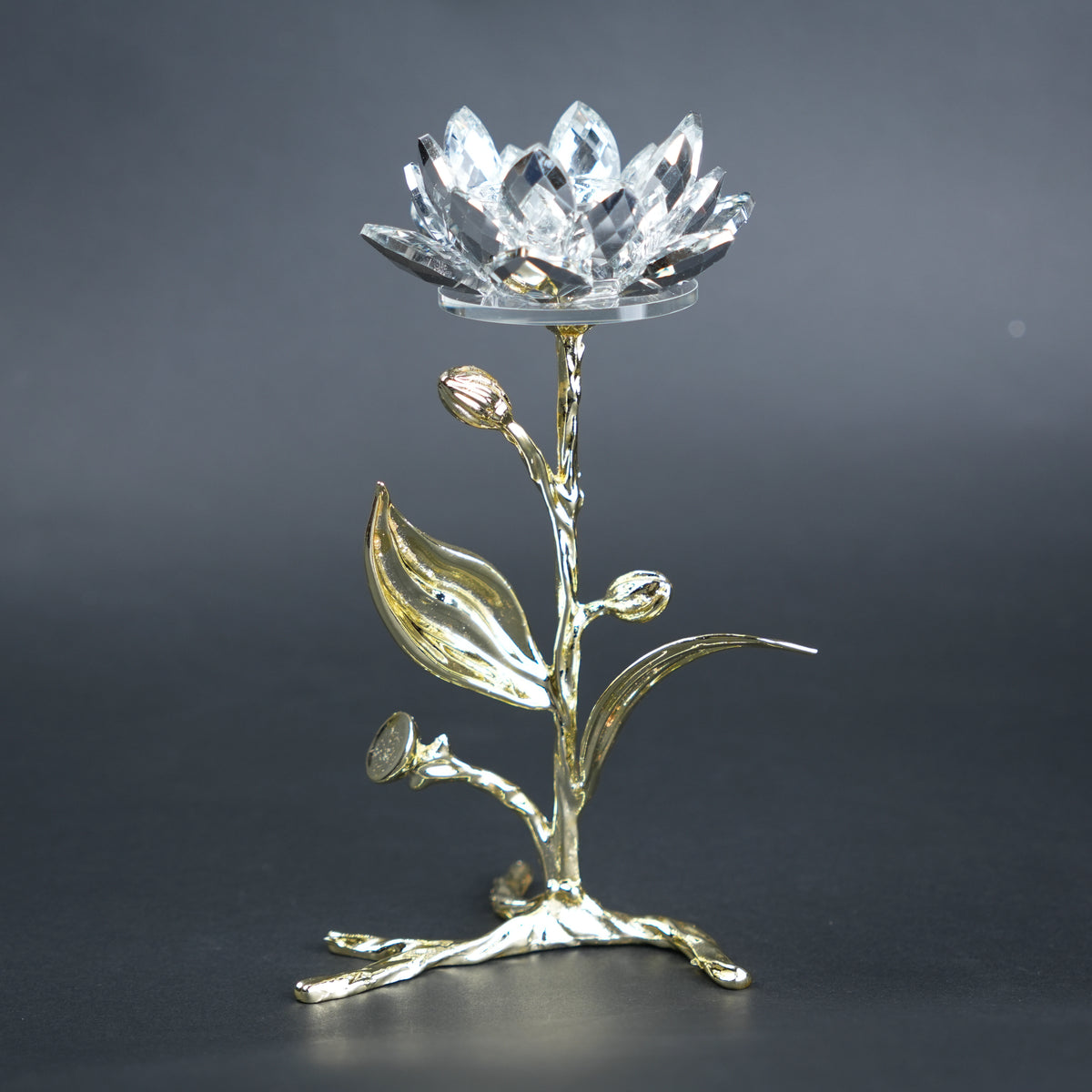 Decorative crystal flower with gold base on a dark background