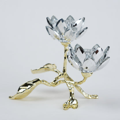Crystal flower-shaped candle holder with gold base on a light gray background