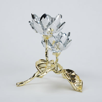 Crystal flower with gold base on a light gray background