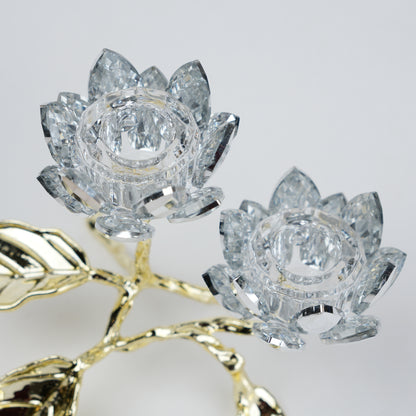 Crystal lotus flowers with gold stem on a light gray background
