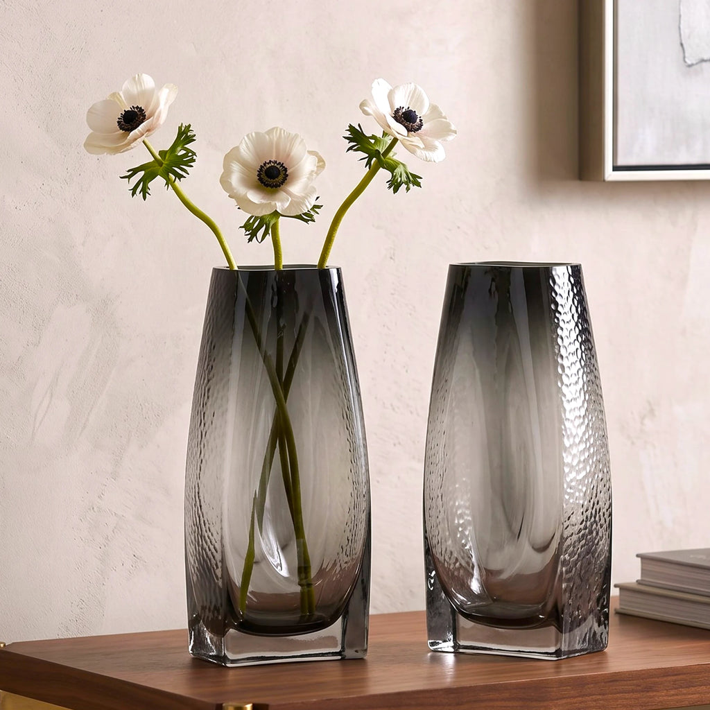 Curved grey vase pair w/ rose, travertine