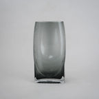 Curved grey vase pair w/ rose, travertine