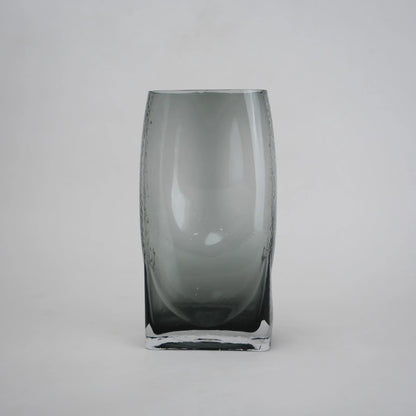 Curved grey vase pair w/ rose, travertine