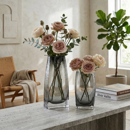 Curved grey vase pair w/ rose, travertine