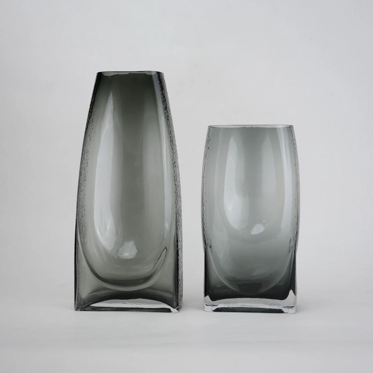 grey modern glass vase with curved interior design