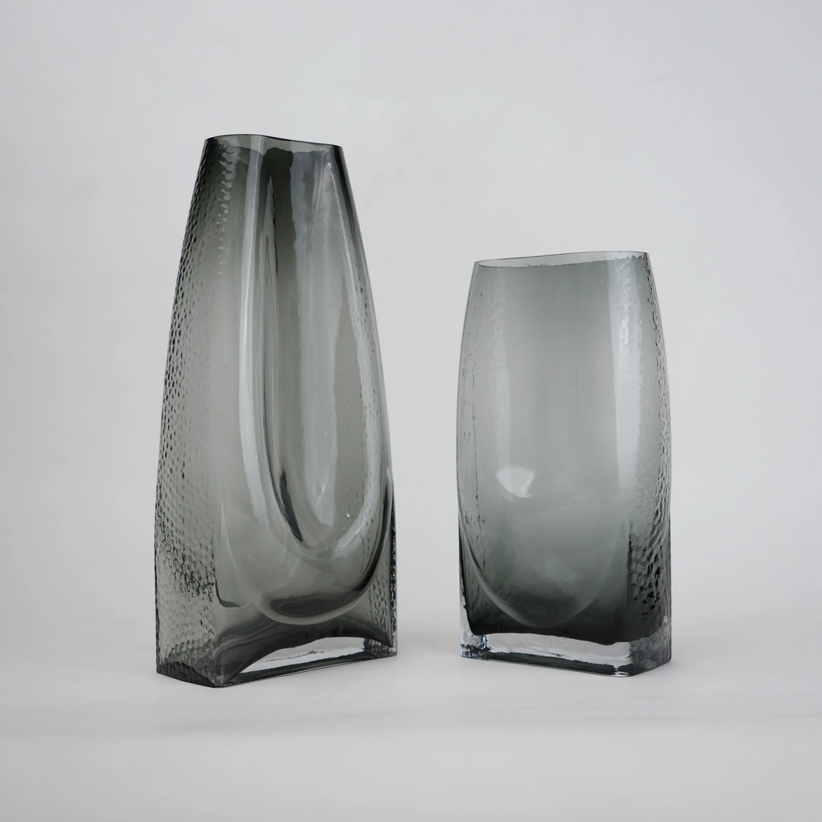 grey modern glass vase with curved interior design