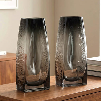 Curved grey vase pair w/ rose, travertine