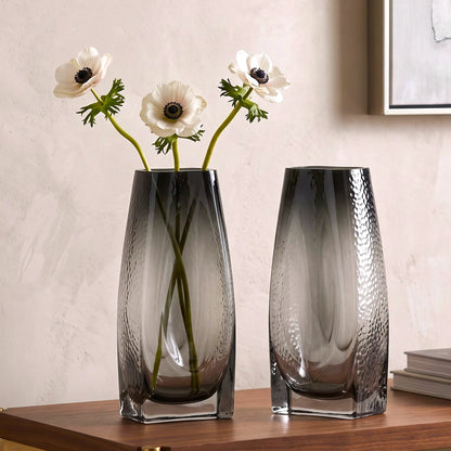 Curved grey vase pair w/ rose, travertine