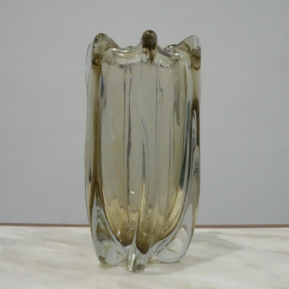 Contemporary art glass vase featuring fluid wave inspired form and handcrafted sculptural detailing for elegant interiors