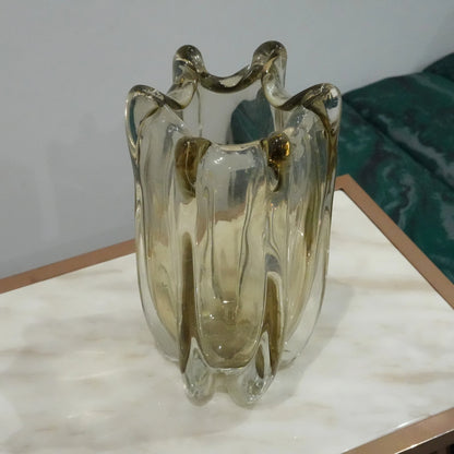 Artisan blown glass vase with soft smoke tint and flowing contemporary silhouette for upscale interior decoration