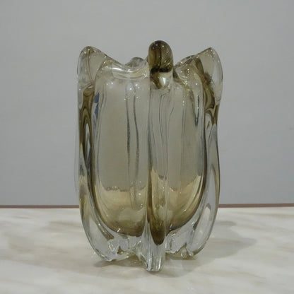 Modern decorative glass vase with smoked transparent finish and organic curved silhouette for luxury home decor