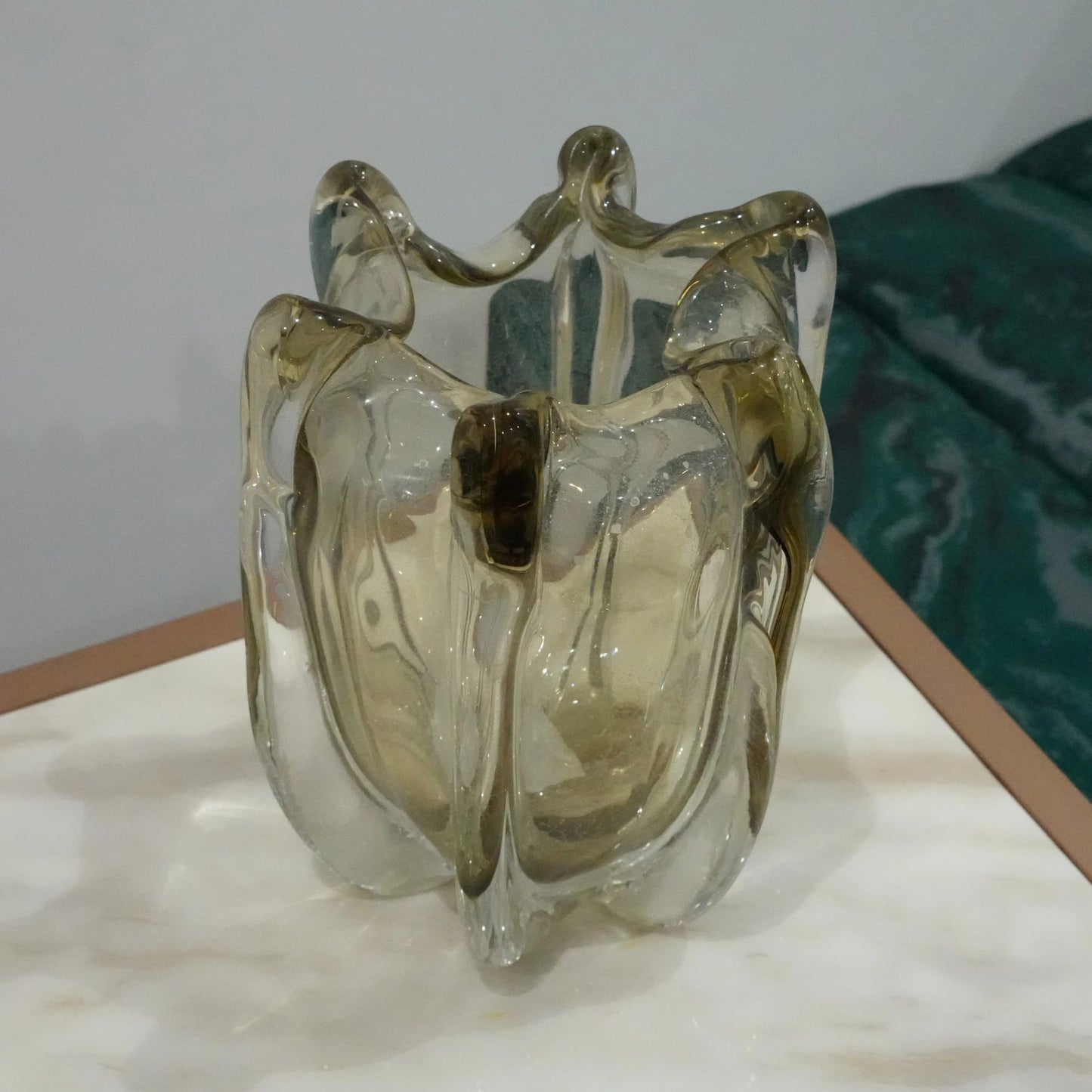 Artisan blown glass vase with soft smoke tint and flowing contemporary silhouette for upscale interior decoration