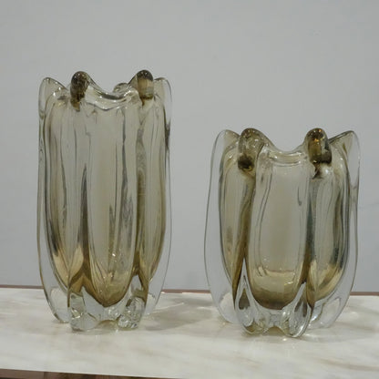 Contemporary art glass vase featuring fluid wave inspired form and handcrafted sculptural detailing for elegant interiors