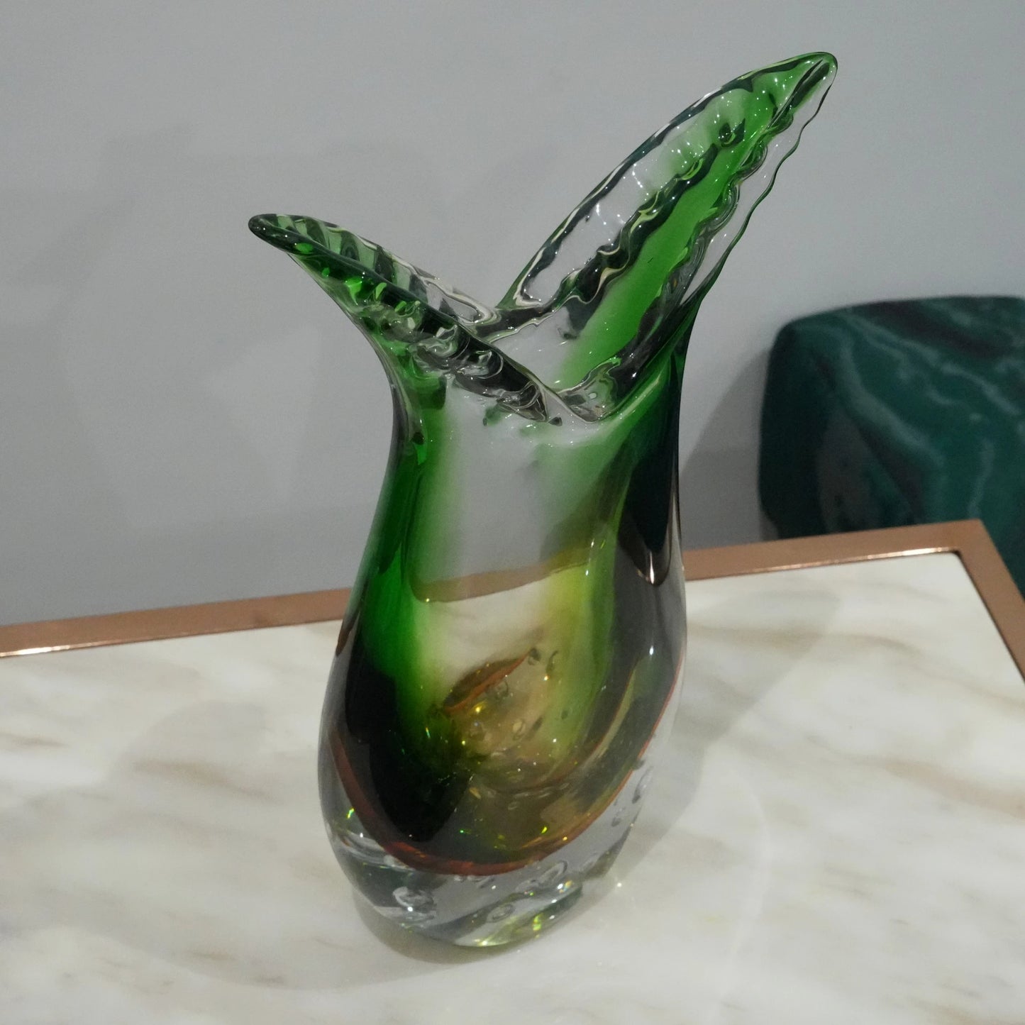 Luxury handblown glass vase featuring sculptural curved form, clear bubble base and contemporary decorative styling for interiors