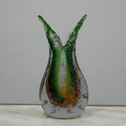 Handblown artistic glass vase with organic twisted silhouette, bubble detailing and green amber gradient finish for luxury decor
