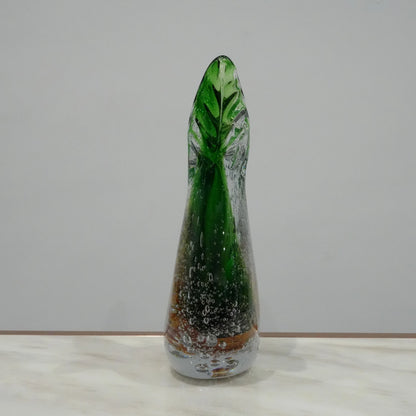 Luxury artisan glass vase with flowing asymmetrical curves and translucent green amber finish for elegant tabletop styling