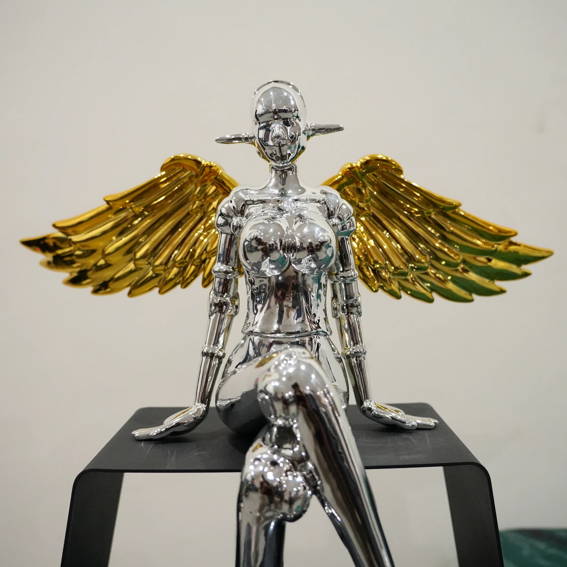 Mirror silver winged lady decor accent with gold detailing and black frame