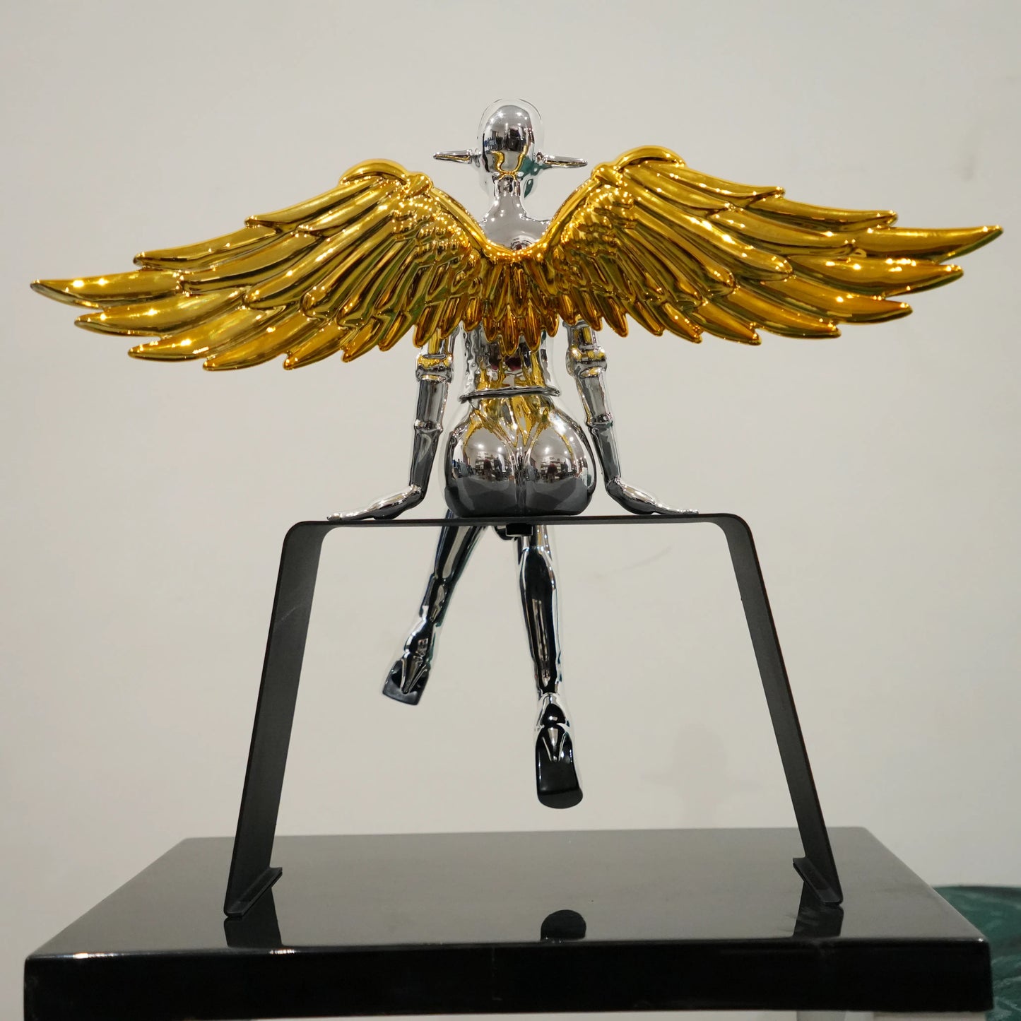 Artistic silver angel decor with antique gold wings for modern interiors