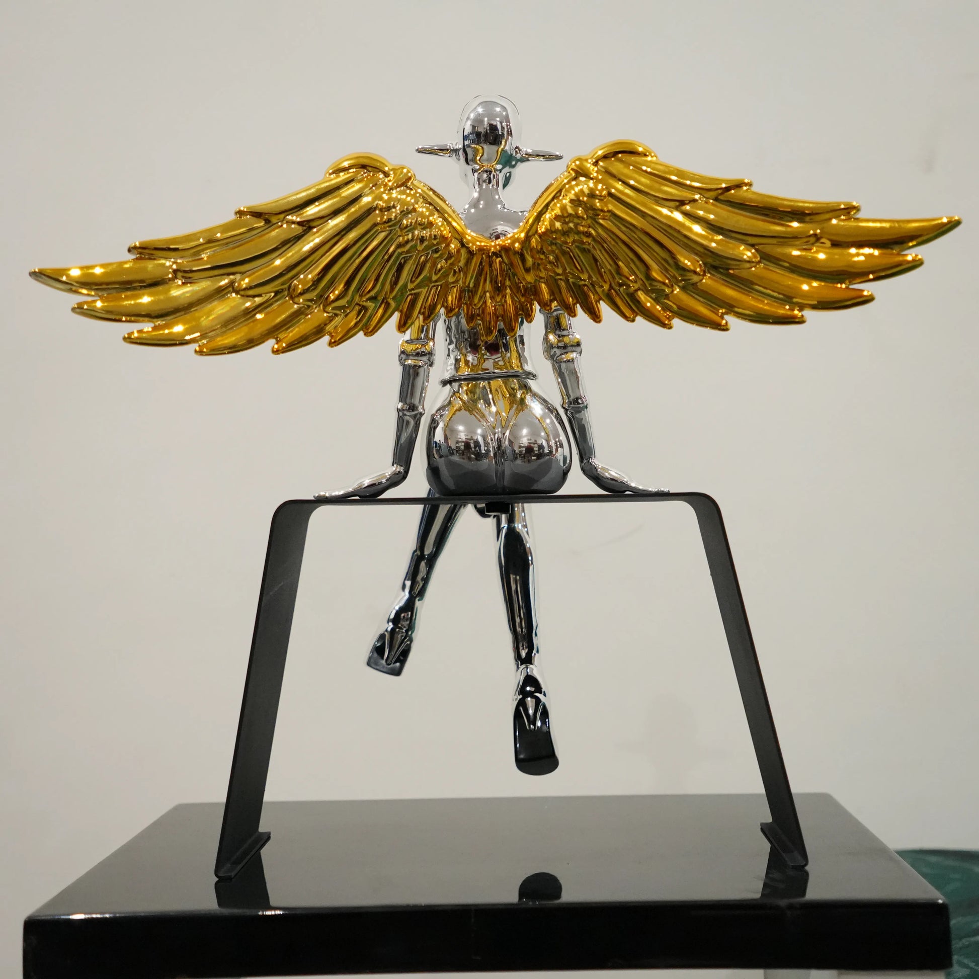 Artistic silver angel decor with antique gold wings for modern interiors