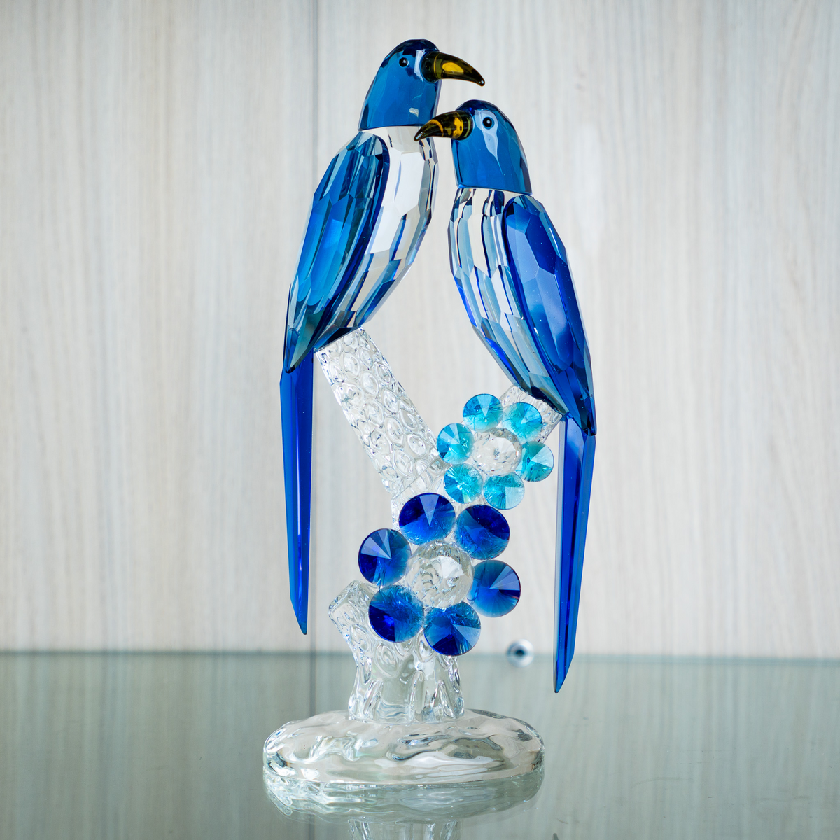 Blue parrot decorative accent with floral crystal details