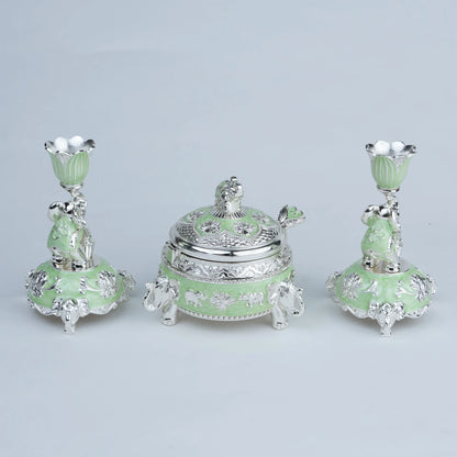 Mint green elephant décor set with ornate silver detailing and matching candle holders