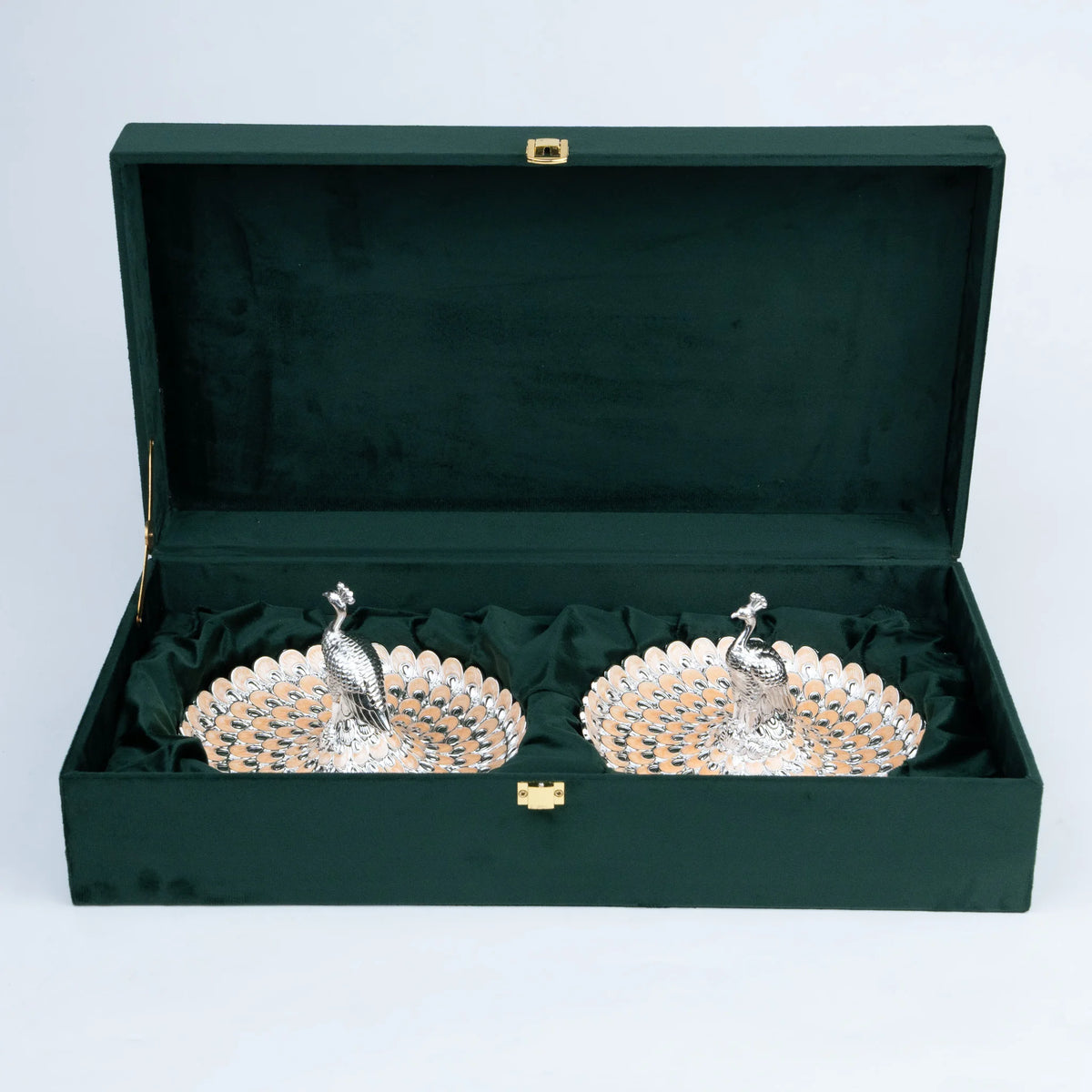 Luxury peacock platter set displayed in a forest green Ghar Art presentation case