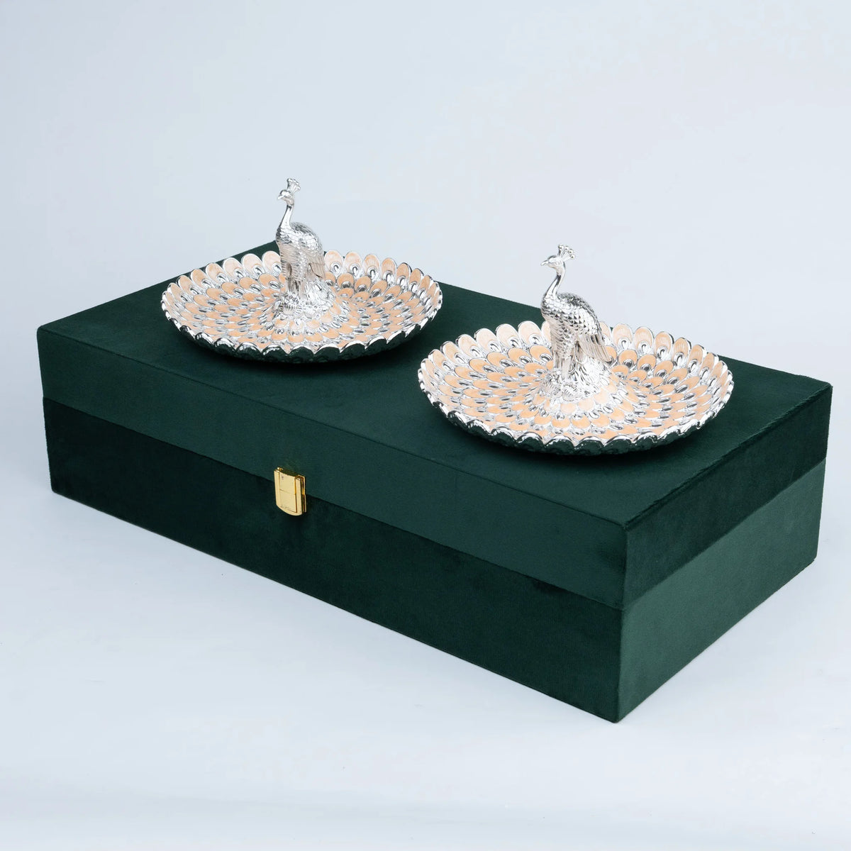 Detailed peacock decorative platter with metallic silver and champagne feather pattern