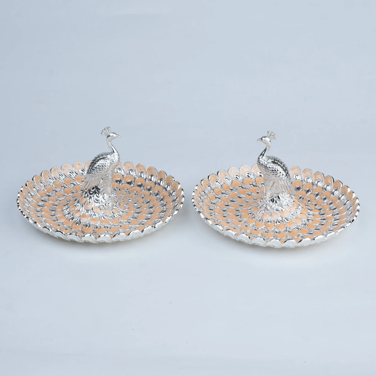 Royal peacock serving platter set with intricate feather detailing for festive table decor