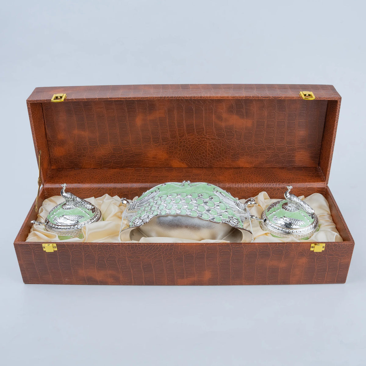 Royal peacock dry fruit set with decorative silver peacock detailing and premium brown storage case