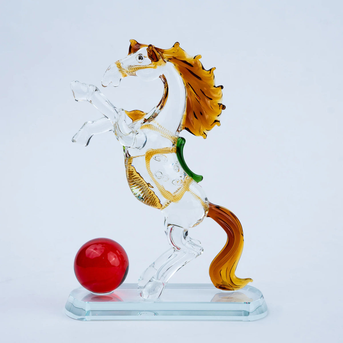 Contemporary crystal horse ornament with amber mane and red sphere