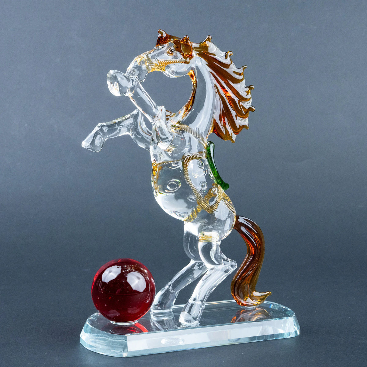 Decorative crystal horse sculpture with amber mane and transparent base