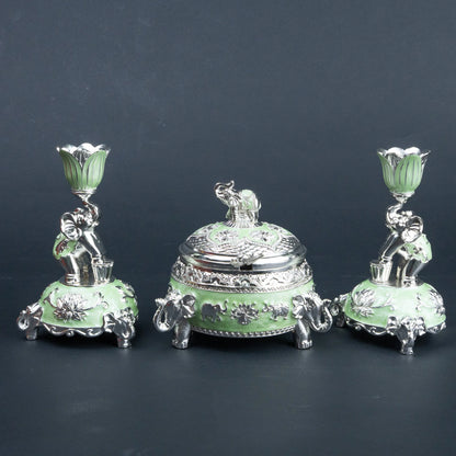 Mint green and silver elephant decorative set styled as a festive tabletop centrepiece