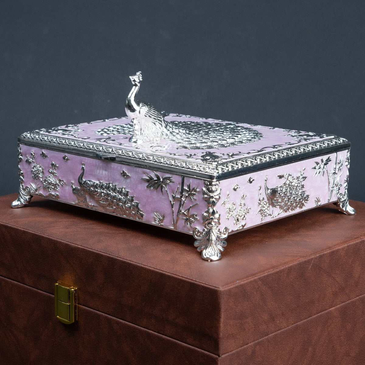 Pink jewellery organiser with raised silver peacock motif and six storage compartments