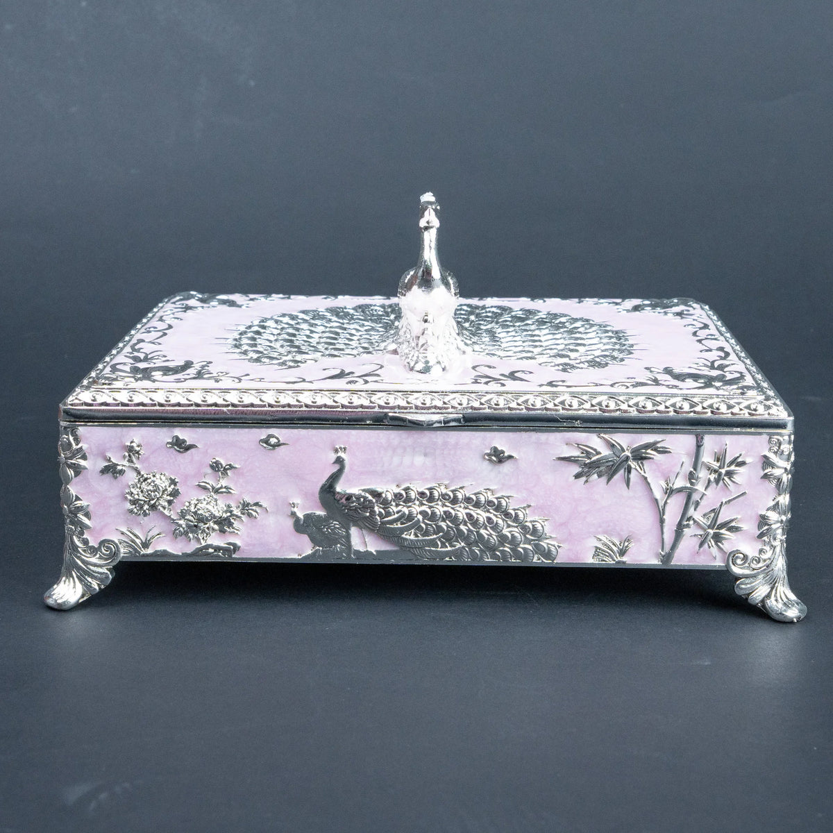 Ornate peacock jewellery box with burgundy lined interior and compartmentalised storage
