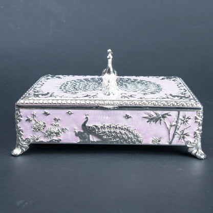 Ornate peacock jewellery box with burgundy lined interior and compartmentalised storage