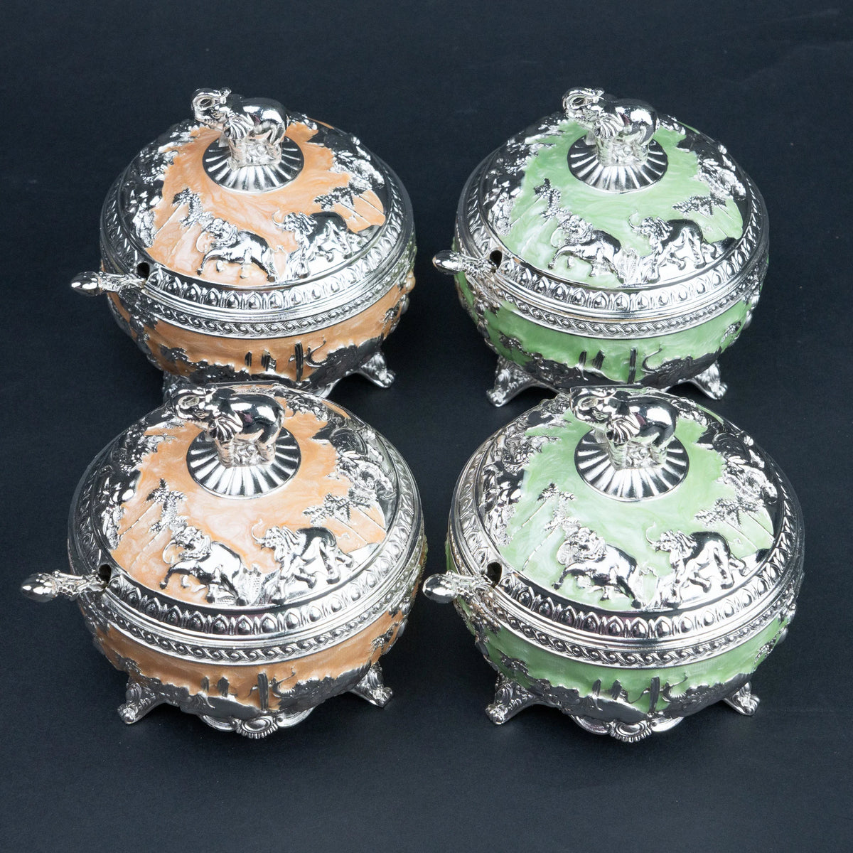 Mint green and peach elephant decorative containers with silver detailing and matching spoons