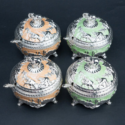 Mint green and peach elephant decorative containers with silver detailing and matching spoons