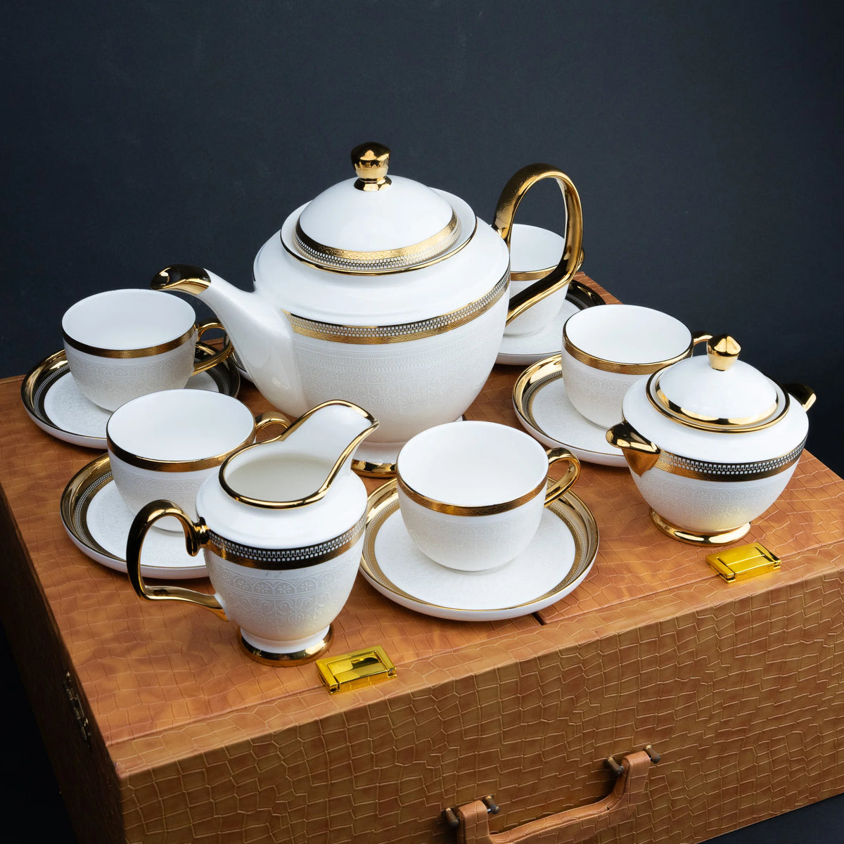 Ghar Art Heritage White 15-piece tea set with gold detailing in luxury cognac presentation case