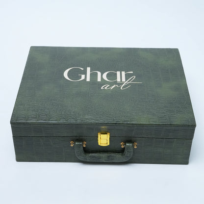 A dark green textured presentation box with a handle and gold clasp, featuring the brand name 'Ghar art' printed in white on the lid, set against a plain white background.