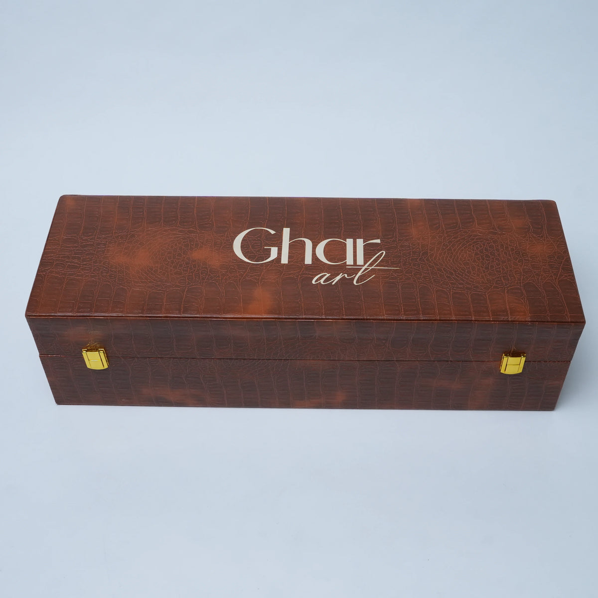 Royal peacock dry fruit set with decorative silver peacock detailing and premium brown storage case