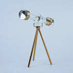 Telescope-style tabletop accent with gold details and a slender tripod